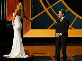 The Academy of Television Arts and Sciences Chairman Bruce Rosenblum speaks as actress Sofia Vergara, from "Modern Family," slowly spins on a turntable during the 66th Primetime Emmy Awards in Los Angeles, California August 25, 2014.   REUTERS/Mario Anzuoni