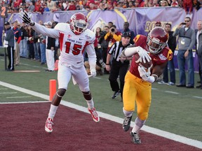 Josh Shaw of the USC Trojans intercepts a pass in the end zone that was intended for Davante Adams of the Fresno State Bulldogs during the Royal Purple Las Vegas Bowl at Sam Boyd Stadium on December 21, 2013. (Ethan Miller/Getty Images/AFP)