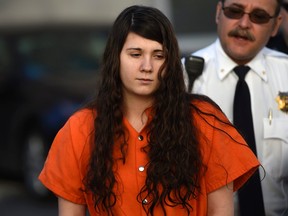 Miranda Barbour, 19, the woman dubbed the so-called Craigslist killer suspect, is led into court by sheriff deputies in Sudbury, Pennsylvania April 1, 2014.    REUTERS/Mark Makela