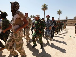 Shi'ite volunteers, who have joined the Iraqi army to fight against militants of the Islamic State. (REUTERS/Ahmed Saad)