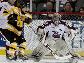 Kingston Frontenacs’ Robert Polesello keeps his eye on the puck in front of Peterborough Petes goalie Andrew D'Agostini during Ontario Hockey League playoff action at the Rogers K-Rock Centre on March 21. Polesello will be one of the Frontenacs’ three overage players this season. (IAN MACALPINE/THE WHIG-STANDARD)