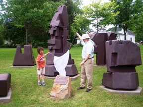 Ben Cartwright and mayor Jim Garrah unveil the name of the Redinger sculture in Gananoque in 2008. (Lorraine Payette)