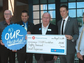 BMO Bank of Montreal visited St. Thomas Elgin General Hospital Tuesday to announce an $80,000 pledge to the hospital's expansion campaign. On hand for the presentation, from left - Ken Monteith, campaign chairman; Drew White, BMO financial planner; Paul Collins, hospital president and CEO; Chris Holder, St. Thomas BMO branch manager; Bill Brown, hospital foundation president; Daniel Monid, BMO regional vice-president; John Rozeluk, BMO community accounts manager; Paul Jenkins, hospital foundation executive director. (Ian McCallum, Times-Journal)