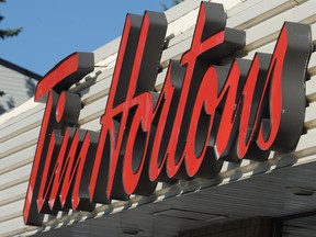 Tim Hortons has agreed to be bought by the company that owns Burger King in a deal that could culminate in the worlds third largest fast-food chain. (Stuart Dryden/QMI Agency)