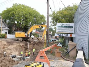 Gino Donato/The Sudbury Star
Crews work on Frood Road, where road reconstruction with watermain  and sewer improvements are taking place from Kathleen Street to Shevchenko Avenue in this file photo.