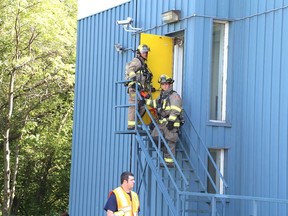 Gino Donato/The Sudbury Star   
Greater Sudbury Fire Services responded to a fire at 166 Louis St. on Tuesday. One person was sent to hospital with smoke inhalation.