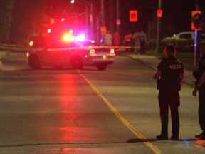 Kingston Police investigate a hit and run that took place at Division and Stephen streets around 10 p.m., Tuesday, Aug. 26. A 44-year-old Kingston man is now facing charges. (Eric Healey/For The Whig-Standard)