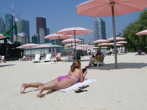 Sunbathing at Waterfront Toronto's Sugar Beach. (Stan Behal/Toronto Sun files)