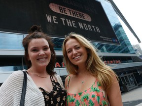 Carly McKee, 19, (L) and Tori Lovegrove, 19, talk possible NHL expansion outside the ACC Wednesday, August 27, 2014. (Jack Boland/Toronto Sun)