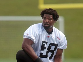 RedBlacks offensive lineman D.J. Young stretches during practice Wednesday at TD Place. Young's father played six seasons in the NFL as a tight end. (Tony Caldwell/Ottawa Sun)