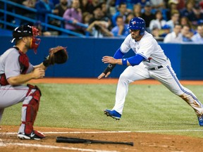 Toronto Blue Jays outfielder Kevin Pillar jumps toward home plate against the Boston Red Sox at the Rogers Centre in Toronto, Aug. 27, 2014. (ERNEST DOROSZUK/QMI Agency)