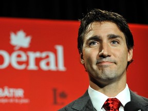 Liberal leader Justin Trudeau speaks to the media during the Federal Liberal summer caucus meetings in Edmonton August 20, 2014.  (REUTERS/Dan Riedlhuber)