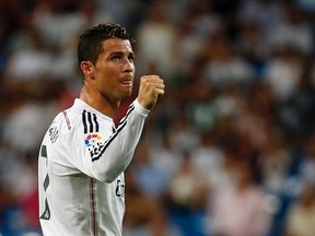 Real Madrid's Cristiano Ronaldo celebrates after scoring a goal against Cordoba during their Spanish first division soccer match at Santiago Bernabeu stadium in Madrid August 25, 2014.  (REUTERS)