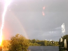 Swede Ingela Tanneskog was recording a rainbow that formed over some trees by a lake when suddenly lightning struck just metres away.
(Screenshot from YouTube)