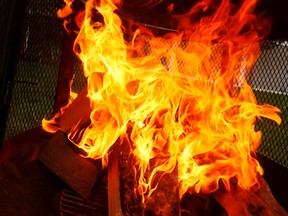 A backyard fire pit burns in Edmonton, Alta., on Wednesday, August 27, 2014. Tom Braid/Edmonton Sun/QMI Agency