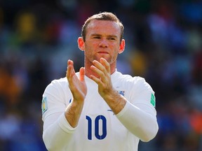 England's Wayne Rooney applauds at the end of their World Cup match against Costa Rica at the Mineirao Stadium in Belo Horizonte on June 24, 2014. Rooney was named England captain on Thursday. (Damir Sagolj/Reuters)