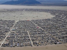 An aerial view during the Burning Man 2014 "Caravansary" arts and music festival in the Black Rock Desert of Nevada August 27, 2014. People from all over the world have gathered at the sold out festival to spend a week in the remote desert cut off from much of the outside world to experience art, music and the unique community that develops. REUTERS/Jim Urquhart