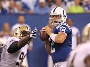 Indianapolis Colts quarterback Andrew Luck (12) under pressure during the second quarter against the New Orleans Saints at Lucas Oil Stadium. (Pat Lovell-USA TODAY Sports)