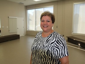 Andree Ferris, director of recreation services for Loyalist Township, stands inside one of the three activity rooms in the new leisure and activity centre that will open Sept. 7, featuring an increased number of programs for residents. (Michael Lea/The Whig-Standard)