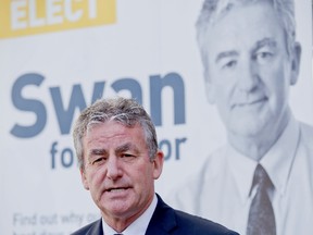 Mayoral candidate Joe Swan holds a press conference beside the Covent Garden Market in London Ontario on Thursday, August 28, 2014. (DEREK RUTTAN, The London Free Press)
