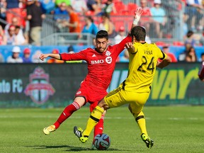 Jonathan Osorio (left) will be available for TFC's two key games against Philladelphia but won't play for Canada next month against Jamaica. (USA Today Sports)