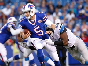 Bills quarterback Jordan Palmer (left) is sacked by Detroit Lions defensive end Devin Taylor during their pre-season game 
at Ralph Wilson Stadium last night. (USA Today Sports)