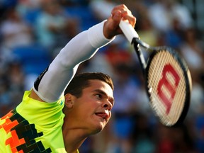 Milos Raonic serves to Peter Gojowczyk during their men's singles match at the U.S. Open in New York, Aug. 28, 2014. (MIKE SEGAR/Reuters)