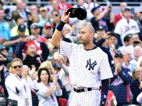 Derek Jeter of the New York Yankees waves to the crowd as he is replaced in the fourth inning during the 2014 MLB All Star Game at Target Field in Minneapolis on July 15, 2014. (SCOTT ROVAK/USA TODAY Sports)