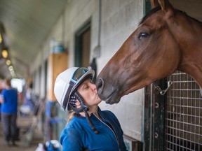In this file photo, apprentice jockey Sheena Ryan poses for a photo with the horse Rebellious Love at Read Baker Racing Stable at Woodbine Racetrack in Toronto. Fans in Sudbury can now bet on races at Woodbine and the Mohawk track in Milton at Champions Sports Bar on Falconbridge Road.
Ernest Doroszuk/QMI Agency