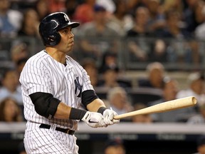 New York Yankees designated hitter Carlos Beltran (36) watches his grand slam home run against the Cleveland Indians during the sixth inning at Yankee Stadium on Aug. 8, 2014. (ADAM HUNGER/USA TODAY Sports)