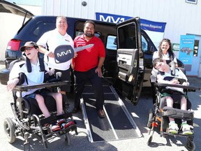 Gino Donato/The Sudbury Star
Paula and  Kyle Watson with their sons Ian and Scott were given the keys to their MV-1 mobility vehicle on Thursday afternoon, giving the Watson's the key is  MV-1 Canada CEO Nick Grande. The National Mobility Equipment Dealers Association invited individuals and families who live with mobility challenges to share their experiences, with a chance to win a new, customized accessibility vehicle worth $50,000.
There were 1,424 entrants in the Local Hero contest where 4 winners were chosen. The Watsons have donated their previous conversion van to  local family with a disabled member.