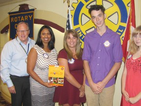 Some of the people who will be taking part in a YMCA building project in Guatemala in March 2015 spoke at the Rotary Club of Chatham meeting on Aug. 27. Posing with club president Don 'Sparky' Leonard, left, are Dr. Samantha Chandrasena, Kaitlyn Smoke, Ethan Lamas and Jackie Forgie. The Rotary Club donated a book on world cooking to the public library in their name.