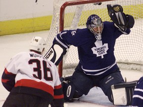 Ottawa Senators' Joe Murphy fires a shot over Toronto Maple Leafs' goalie Mike Minard during first period pre-season NHL action in Ottawa in this Sept. 19, 2001 file photo. (REUTERS)