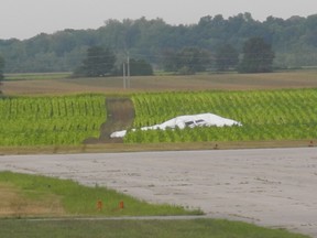 The wreckage of an experimental blimp sits in a field adjacent to the Brantford Airport's tarmac. (SUSAN GAMBLE / Brantford Expositor)