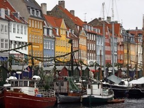 Boats are seen anchored at the 17th century Nyhavn district, home to many shops and restaurants in Copenhagen December 5, 2009. Reuters/Bob Strong