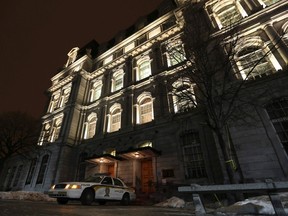 A Surete du Quebec police car sits outside the doors of Montreal City Hall in this February 19, 2013 file photo. (Reuters/Christinne Muschi)
