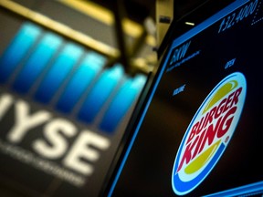 The Burger King logo is displayed at the post where the company's stock is traded on the floor of the New York Stock Exchange August 26, 2014. REUTERS/Brendan McDermid