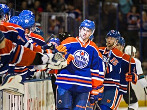 Edmonton's Justin Schultz (19) celebrate his goal against San Jose's goalie Antti Niemi (31), not pictured, during the first period of the Edmonton Oilers' NHL hockey game against the San Jose Sharks at Rexall Place in Edmonton, Alta., on Wednesday, Jan. 29, 2014. Codie McLachlan/Edmonton Sun/QMI Agency