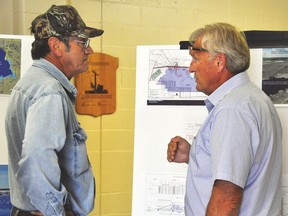 Randy Forsyth, who lives in the Lomond area, talks with Alberta Transportation’s Seamas Skelly at an open house about the province's relocation of the current Little Bow Provincial Recreation Area, which closes after the Labour Day weekend. The new PRA is scheduled to open by the end of July 2016. Stephen Tipper Vulcan Advocate