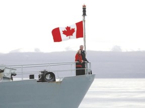 Prime Minister Stephen Harper and his wife Laureen stand on the front deck of the HMCS Kingston on Eclipse Sound near the arctic community of Pond Inlet, Nunavut, last week. (Reuters)