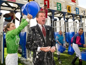 Award-winning rider Emma-Jayne Wilson nominated Woodbine Entertainment Group’s President and CEO Nick Eaves to take the ALS Ice Bucket Challenge and there was only ever going to be one answer. “I’m not one to back down from a challenge, particularly one that benefits such a deserving cause as ALS,” said Eaves. ALS has affected many, including the family of longtime WEG employee Heather Acton, whose husband, Bob, was recently diagnosed with ALS. (MICHAEL BURNS/PHOTO)