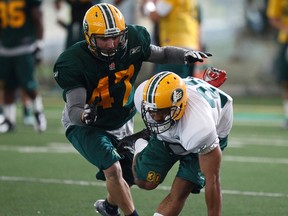 JC Sherritt, shown here running drills in practice in June, made a momentum-changing fumble recovery last week against the Toronto Argonauts. (Ian Kucerak, Edmonton Sun)