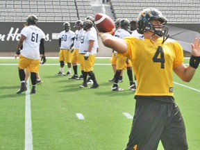 With the O-Line working behind him, Ticats QB Zach Colllaros gets in some passes during Friday’s practice at Tim Hortons Field. (ticats.ca)