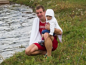Austrian paratriathlete Oliver Dreier spends some time with his daughter, Heidi, at the World Triathlon Series grounds in advance of the World Triathlon Grand Final at Hawrelak Park. (Codie McLachlan, Edmonton Sun)