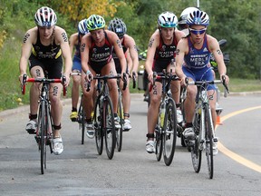 Athletes make progress in the bike portion the Jr. Women’s Race at the ITU World Triathlon Grand Final Friday. The paratriathlon is taking centre stage this weekend. (David Bloom, Edmonton Sun)