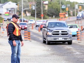 Gino Donato/The Sudbury Star
Members of the  Greater Sudbury Police Services traffic unit conducted a mini blitz and were out searching for distracted drivers on Friday at area road construction sites. Const. Dann Kingsley of the unit blends in with construction workers by wearing a saftey vest and jeans, a total of 35 drivers were charged using handheld devices.