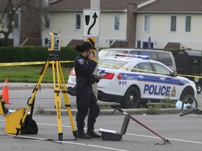 A man in his early 20s suffered life-threatening injuries when he was struck by a vehicle while cycling on Woodroofe Ave. at the intersection of Knoxdale Rd.on Saturday, Aug. 30, 2014.
DOUG HEMPSTEAD/Ottawa Sun