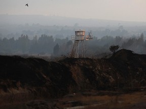 A  U.N. observation tower is seen overlooking Syria, next to the Quneitra border crossing between the Israeli-controlled Golan Heights and Syria, August 29, 2014. Militants fighting the Syrian army have detained 43 U.N. peacekeepers in the Israeli-occupied Golan Heights and trapped another 81 in the region, and the world body is working to secure their release, the United Nations said on Thursday.(REUTERS/Ronen Zvulun)