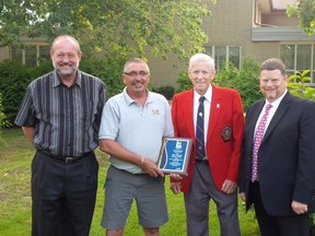From left to right:  Don Adam, the executive director of the Huron House Boy's Home stands beside Mike Blondin as he receives his Citizen of the Month honour from city-county councillor Jim Foubister and Warden Todd Case. (Submitted photo)