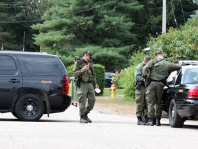 Members of the OPP Emergency Response Team man a road block at the intersection of Labine Crescent and Hoffman Street in Petawawa Saturday morning. A stand-off at a Labine Crescent residence has entered its second day. Police are not saying what the nature of the incident is. (SEAN CHASE/DAILY OBSERVER)